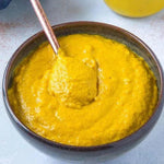 Brook Mustard Powder 50g in a clear jar, dry grocery product with bright yellow mustard powder visible inside.