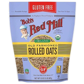 Bob's Red Mill gluten-free organic rolled oats in a resealable grocery bag, showing the product label and oats inside.