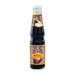 Deksomboon Black Soy Sauce 410g bottle, traditional Asian dry grocery condiment with dark soy sauce in a glass bottle