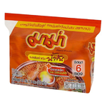 Mama Creamy Tom Yum Goong instant noodles in a bowl with shrimp, herbs, and spicy broth, showcasing a flavorful Thai noodle dish.