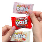 Nezline oat ring snack coated with chocolate milk, showing a close-up of the crunchy, oat-filled confectionery treat.