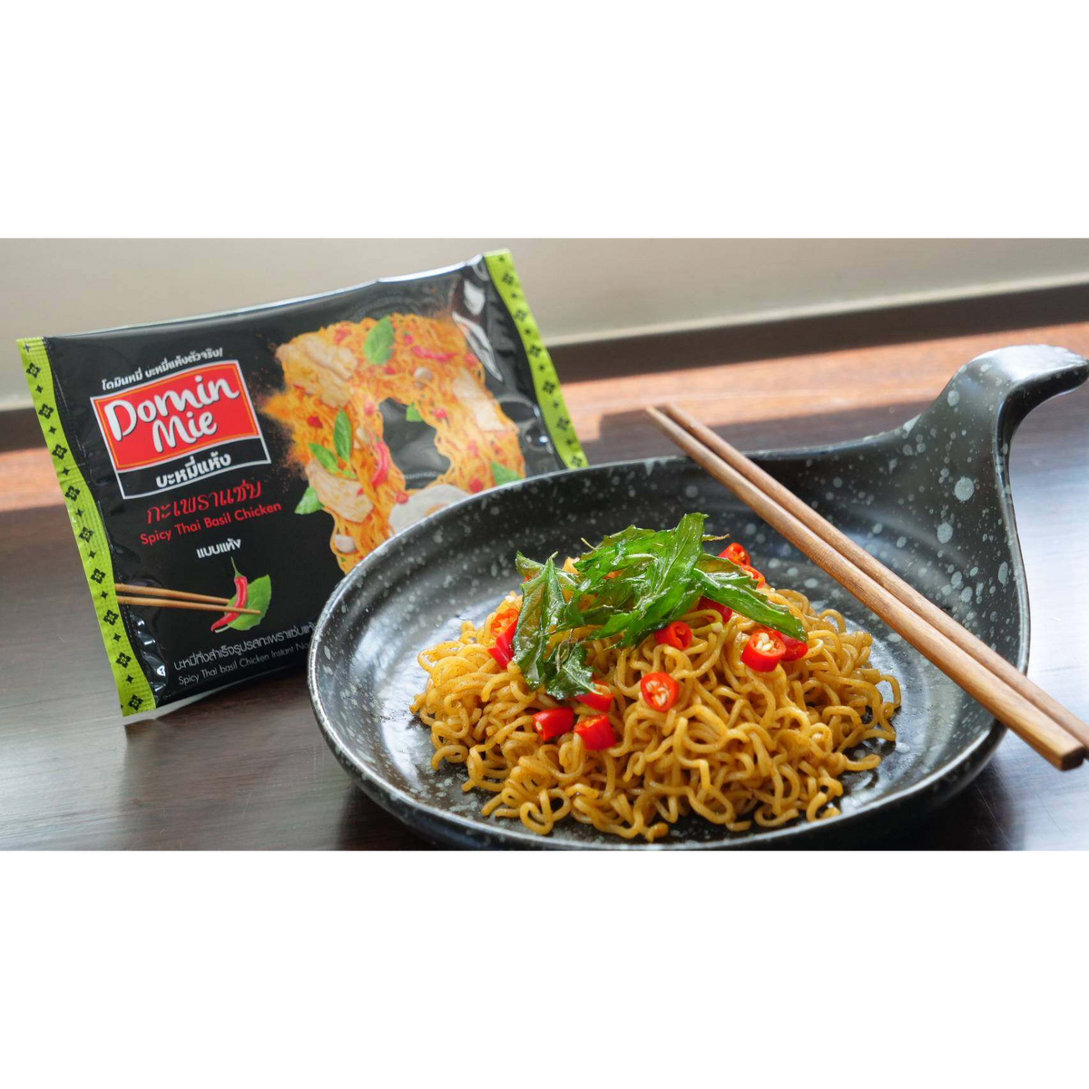 Spicy Thai Basil Chicken instant noodle pack by Domin Mie with colorful packaging, showcasing the flavor and brand.