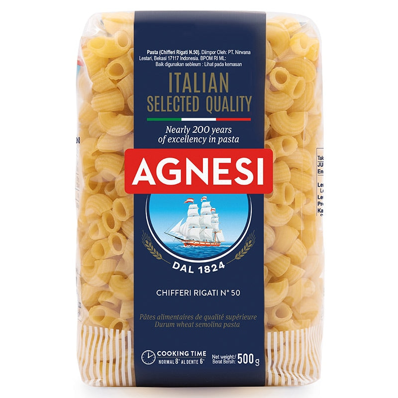 Agnesi Chifferi Rigati pasta N50, Italian grocery product, uncooked pasta with ridged, twisted shape in a clear bowl