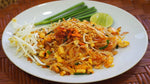 J-LEK Pad Thai Sauce bottles, 1150g, in clear plastic bottles with orange caps, ideal for authentic Thai cooking.