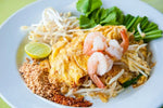 J-LEK Pad Thai Sauce bottles, 1150g, in clear bottles showing rich, dark Thai sauce for authentic cooking.