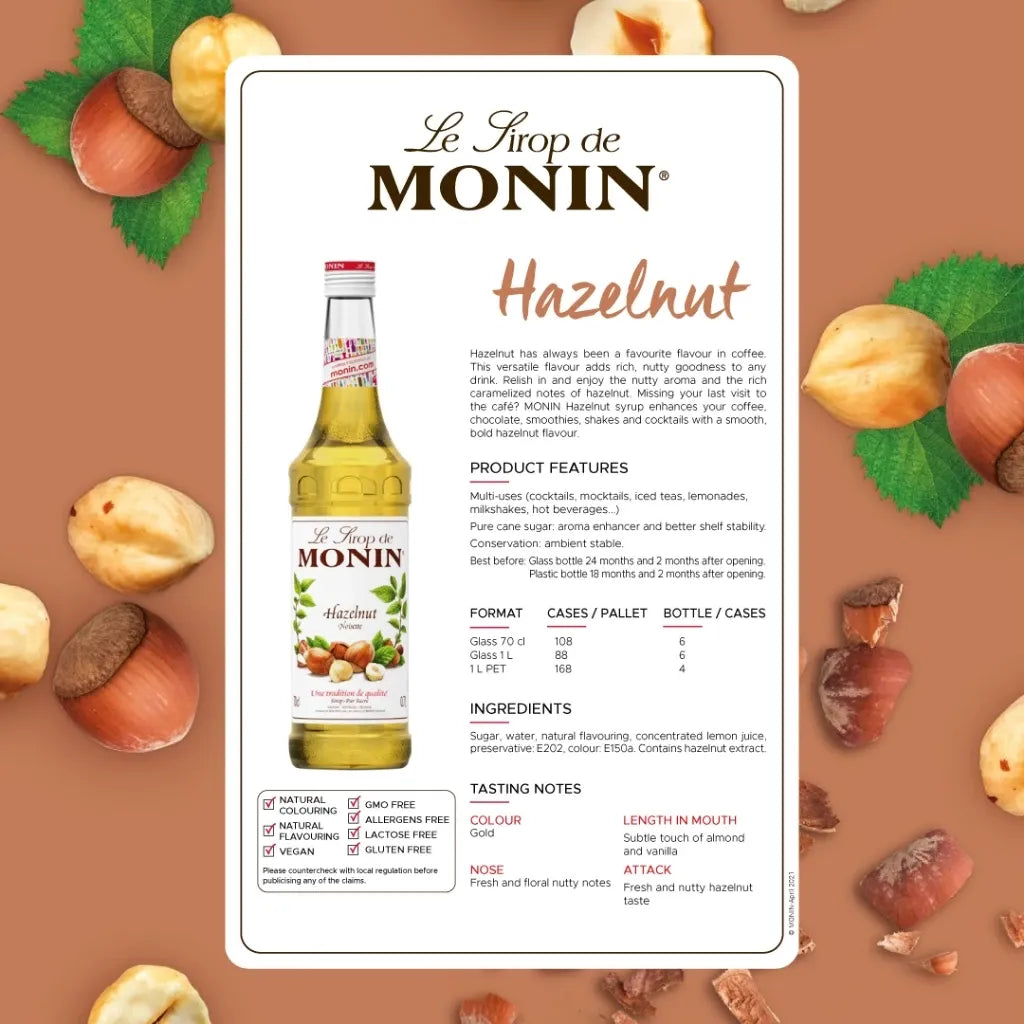 Monin Hazelnut Syrup 700ml bottle, ideal for coffee and desserts, featuring a clear label and dark amber liquid inside.