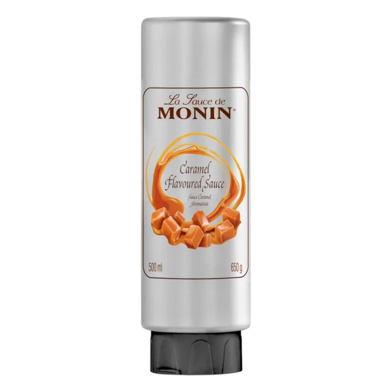 Bottle of MONIN caramel sauce in 500ml bottle, featuring rich caramel color and label, suitable for desserts and coffee.