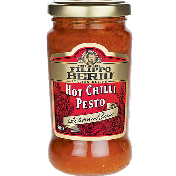Jar of Filippo Berio Pesto Hot Chilli with visible red chili flakes and basil leaves in a glass jar.