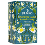 Pukka Chamomile, Vanilla & Manuka Honey caffeine-free herbal tea in a tea bag, showcasing a calming, natural drink.