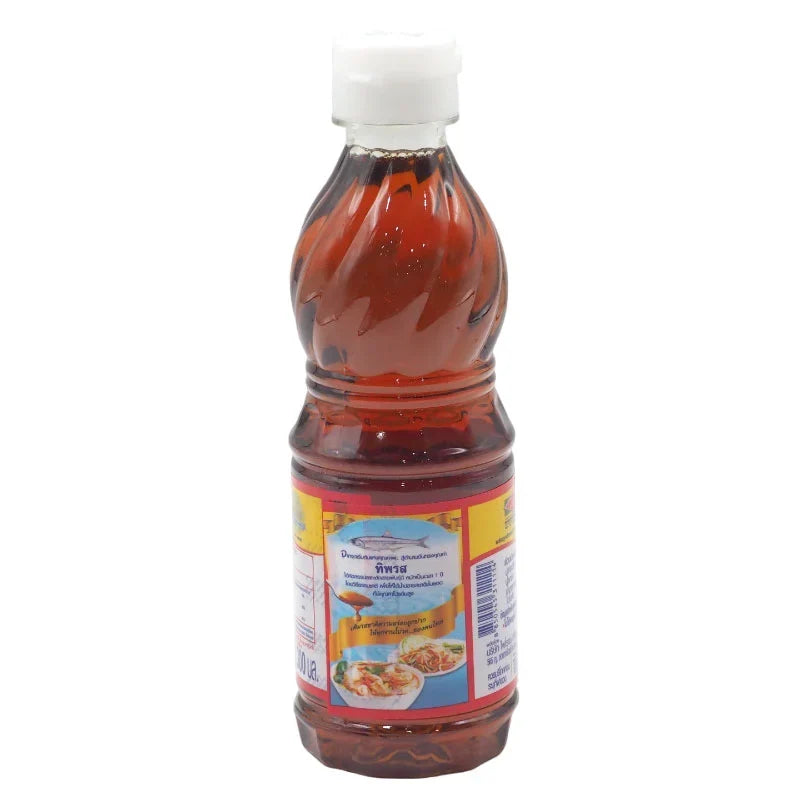 Tiparos Fish Sauce in a 300ml bottle, a popular dry grocery condiment with dark liquid and label, used in Asian cuisine.