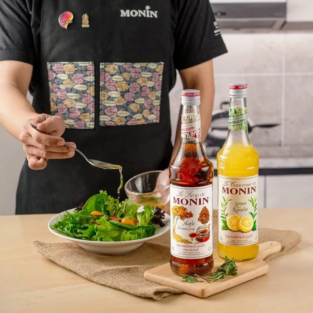 Bottle of MONIN Rantcho Lemon Syrup in 700ml size, featuring clear label and yellow lemon graphics on a white background.
