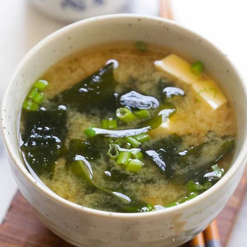 Shinsyuichi instant miso soup with aburaage tofu slices in a bowl, showcasing dry grocery packaging and ingredients.