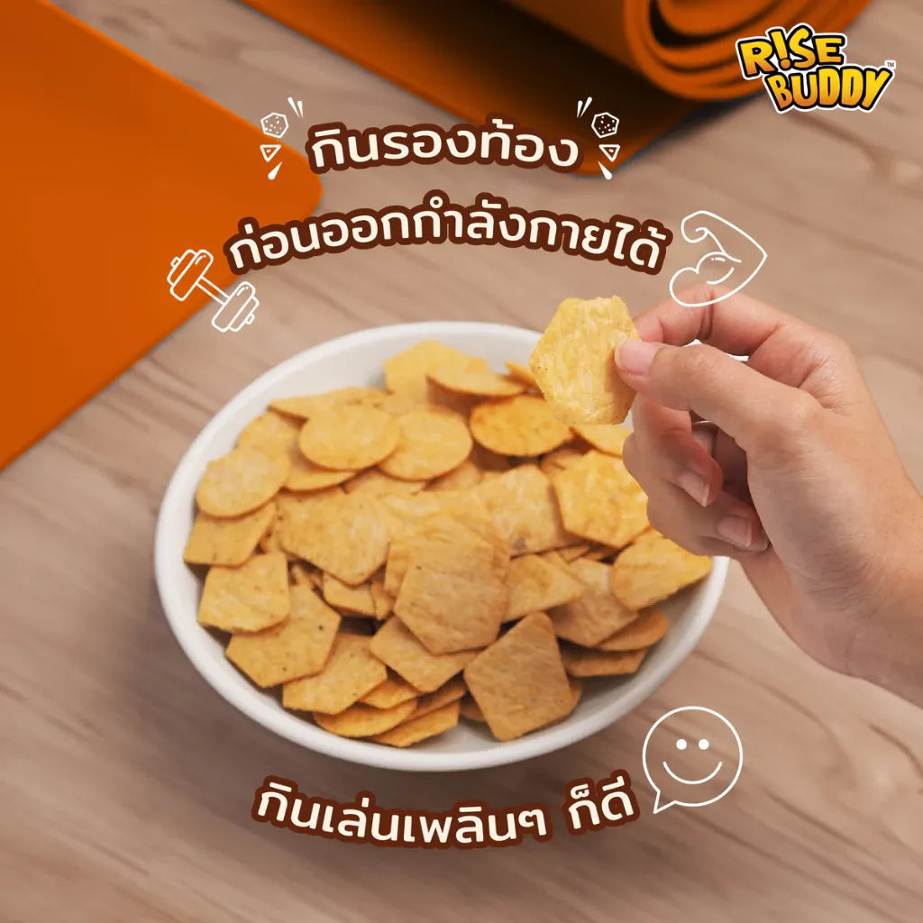 Rise Buddy Crispy Rice Snacks in a clear bowl showing golden, puffed rice snacks from the dry grocery product line.
