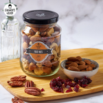 Farmer's Grain mixed nuts in a bowl, showing a variety of colorful nuts and seeds for confectionery snacking.
