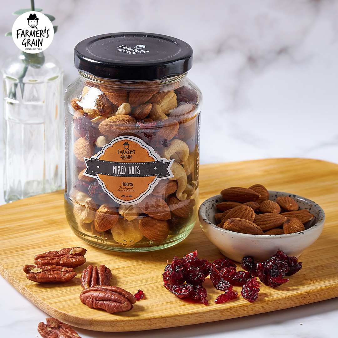 Farmer's Grain mixed nuts in a bowl, showing a variety of colorful nuts and seeds for confectionery snacking.