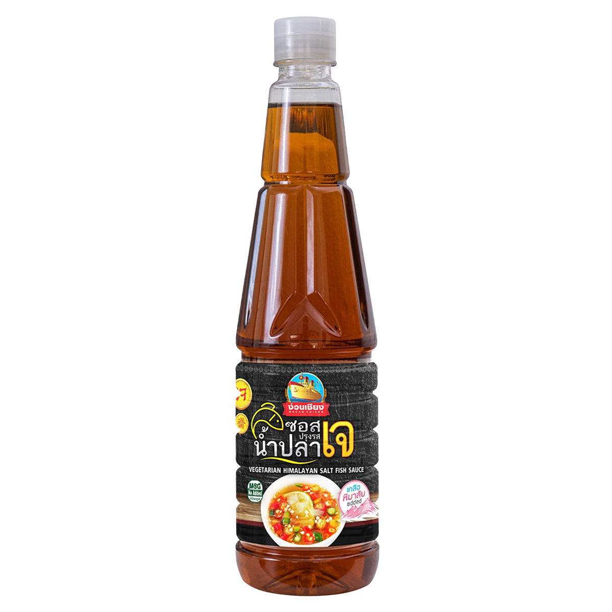 Nguan Chiang Gourmet vegetarian fish sauce made with Himalayan salt, displayed in a clear glass bottle on a grocery shelf.