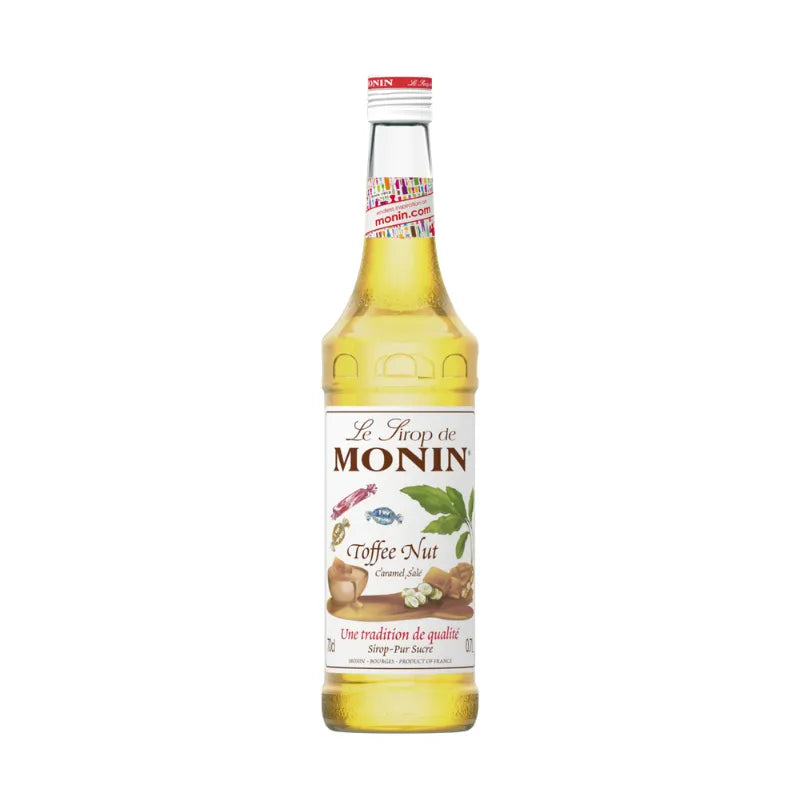 Bottle of MONIN Toffee Nut Syrup 700ml, a dry grocery item, showcasing the caramel-colored syrup in a clear plastic bottle.