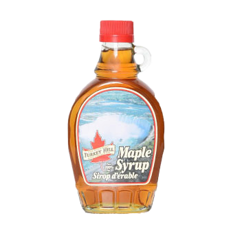 Turkey Hill Niagara Falls 100% Maple Syrup bottle with label and golden syrup inside, ideal for breakfast and baking.