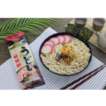 Dry Rabbit Brand Udon Noodles 200g package showing the uncooked, thick wheat noodles in a clear plastic bag.