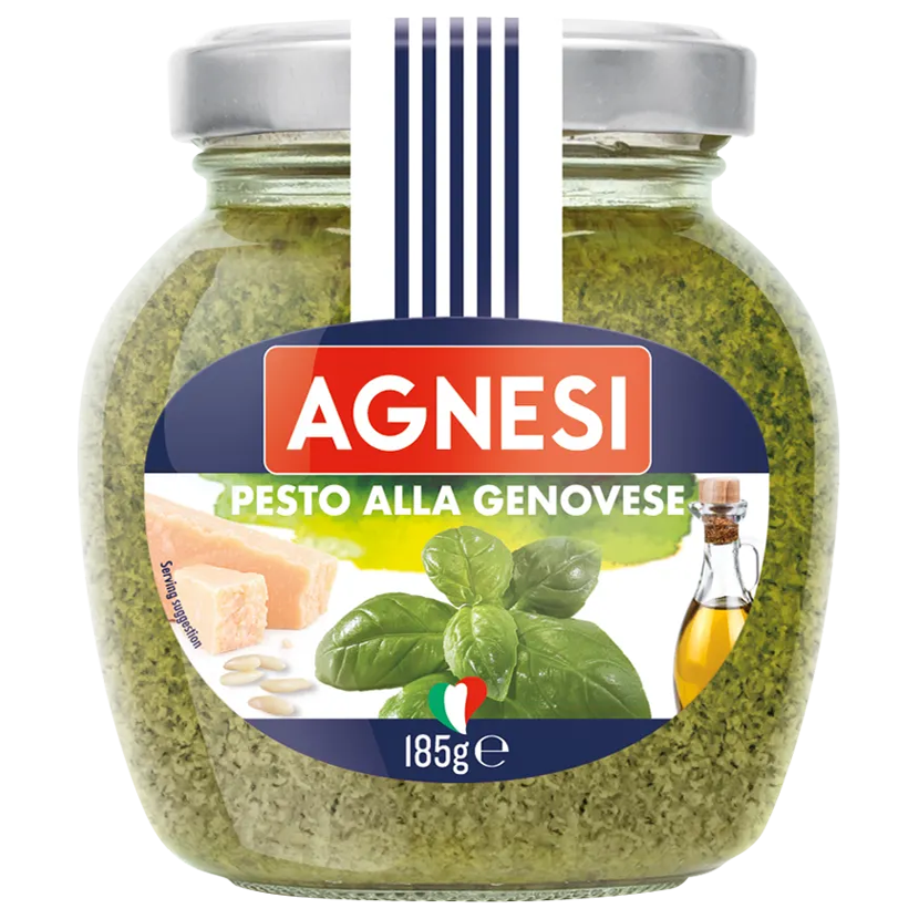 Jar of Agnesi Alla Genovese Pesto Sauce showing the label and fresh basil ingredients on a grocery store shelf.