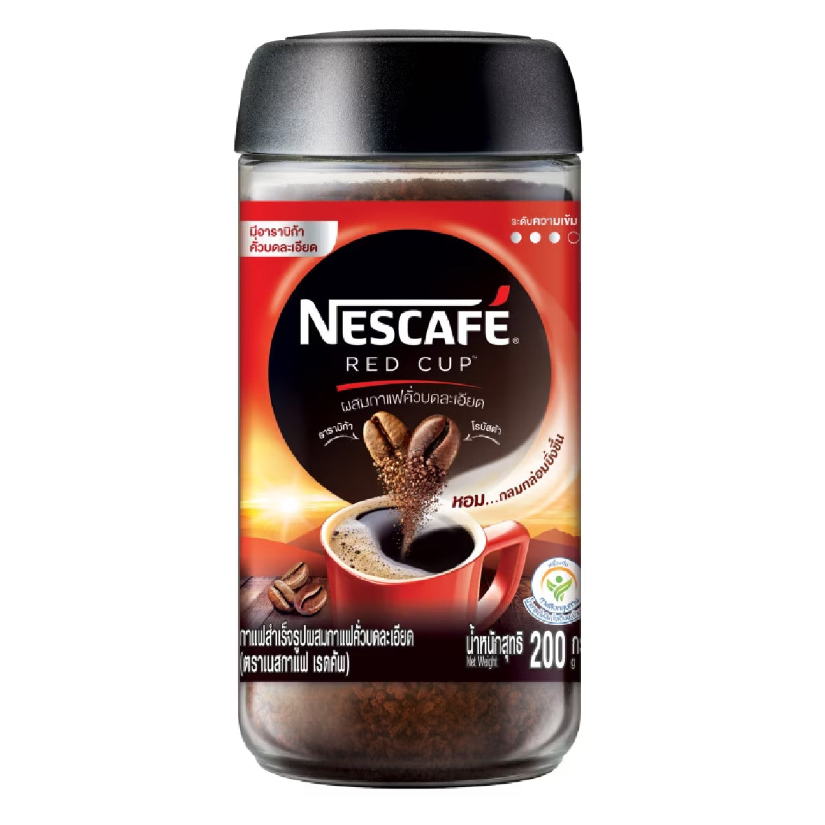 Nescafe Red Cup instant coffee drink in a glass mug with a spoon, showcasing the beverage's rich, dark color.