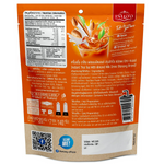 Ranong Thai Tea Almond Milk drink in a clear glass, showcasing its creamy texture and rich tea flavor.