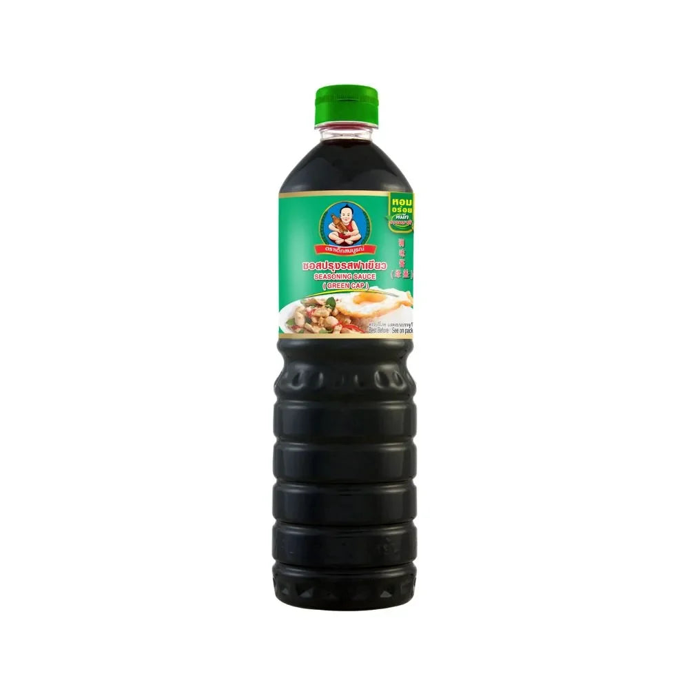 Deksomboon Seasoning Sauce bottle from dry grocery, featuring clear label and dark liquid inside.