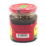 TA Krai Mango Dipping 200g in a clear jar, showcasing the dried mango slices for use as a tasty snack or condiment.
