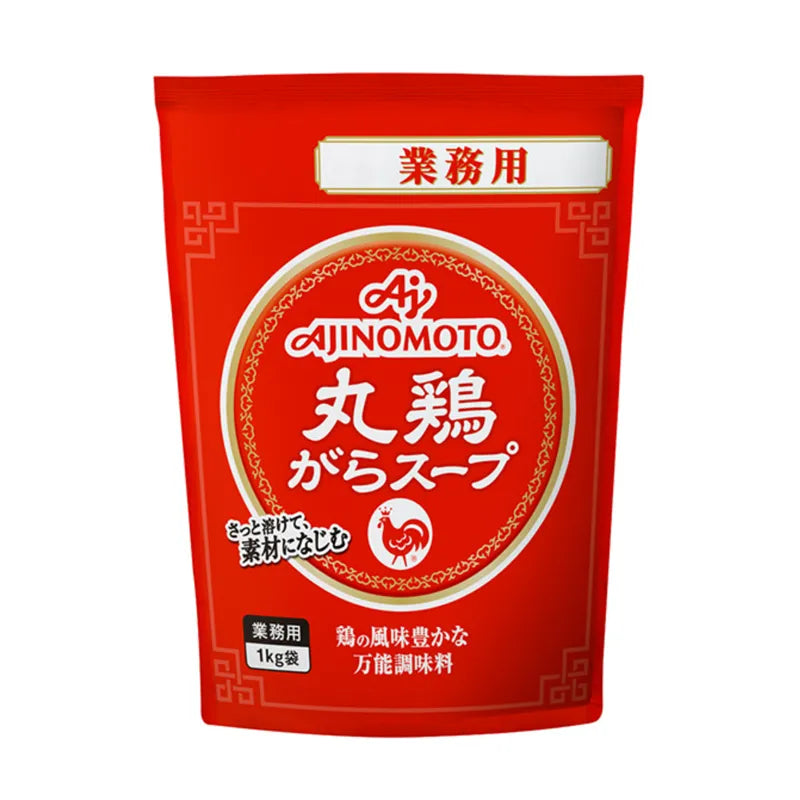 AJINOMOTO Marudori Gara Soup Stock granulated chicken bone broth in a clear container, ready for cooking and flavoring dishes.