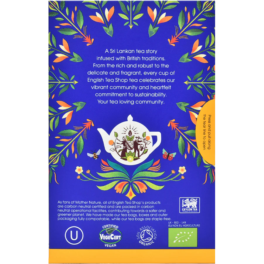 Organic Earl Grey tea bags from English Tea Shop, showcasing the tea packaging and leaves inside a clear container.