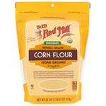 Organic whole grain corn flour from Bob's Red Mill's in a bag, showcasing a golden yellow corn flour suitable for baking and cooking.
