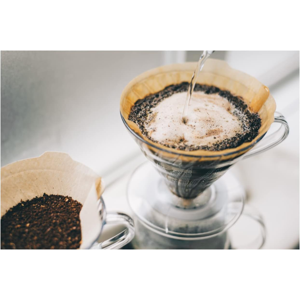Hario V60 Paper Filter 01 M for pour-over coffee brewing, white, stack of filters on a clean surface